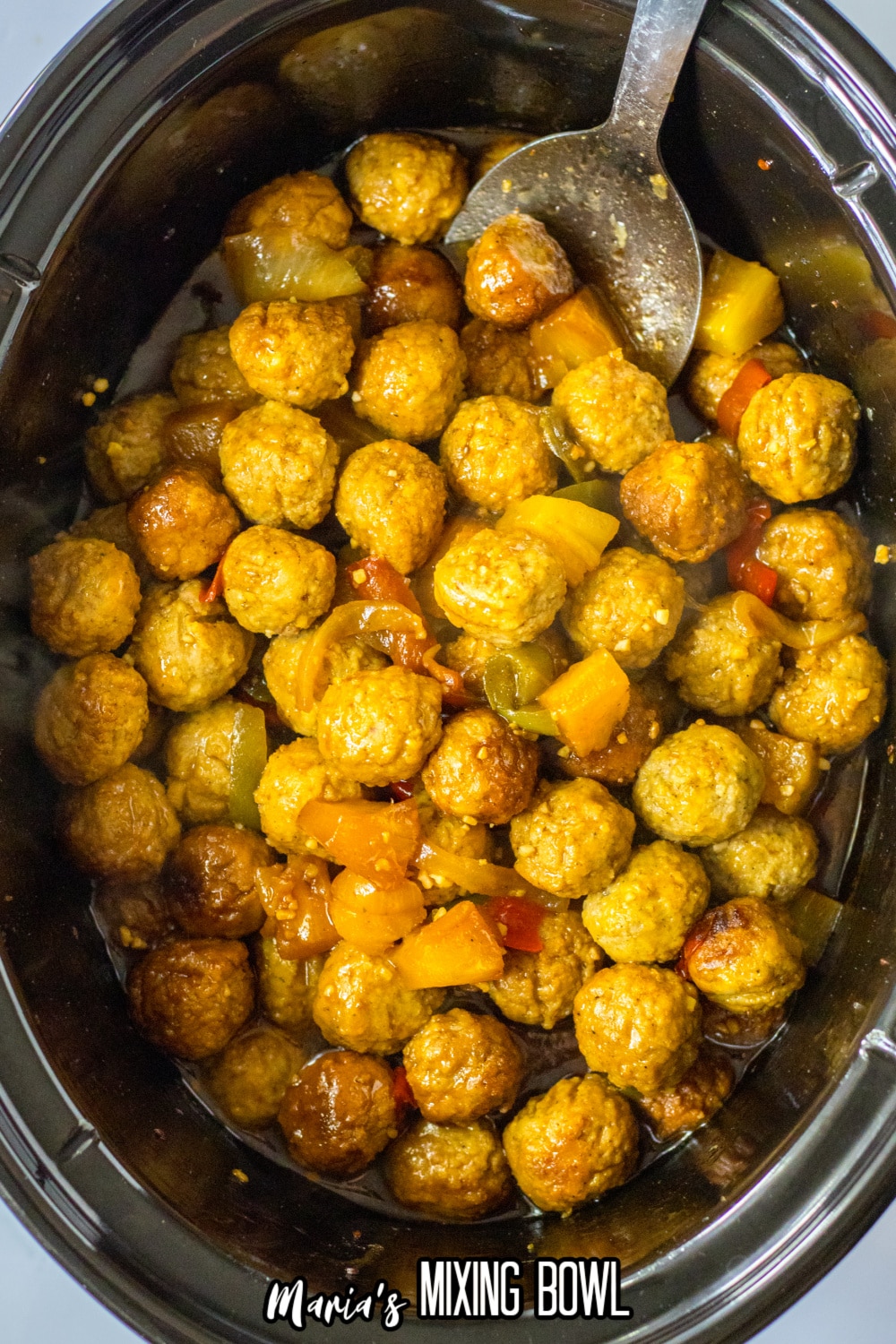 cooked hawaiian meatballs in a slow cooker