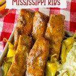 Mississippi ribs in a metal baking tray with mashed potatoes
