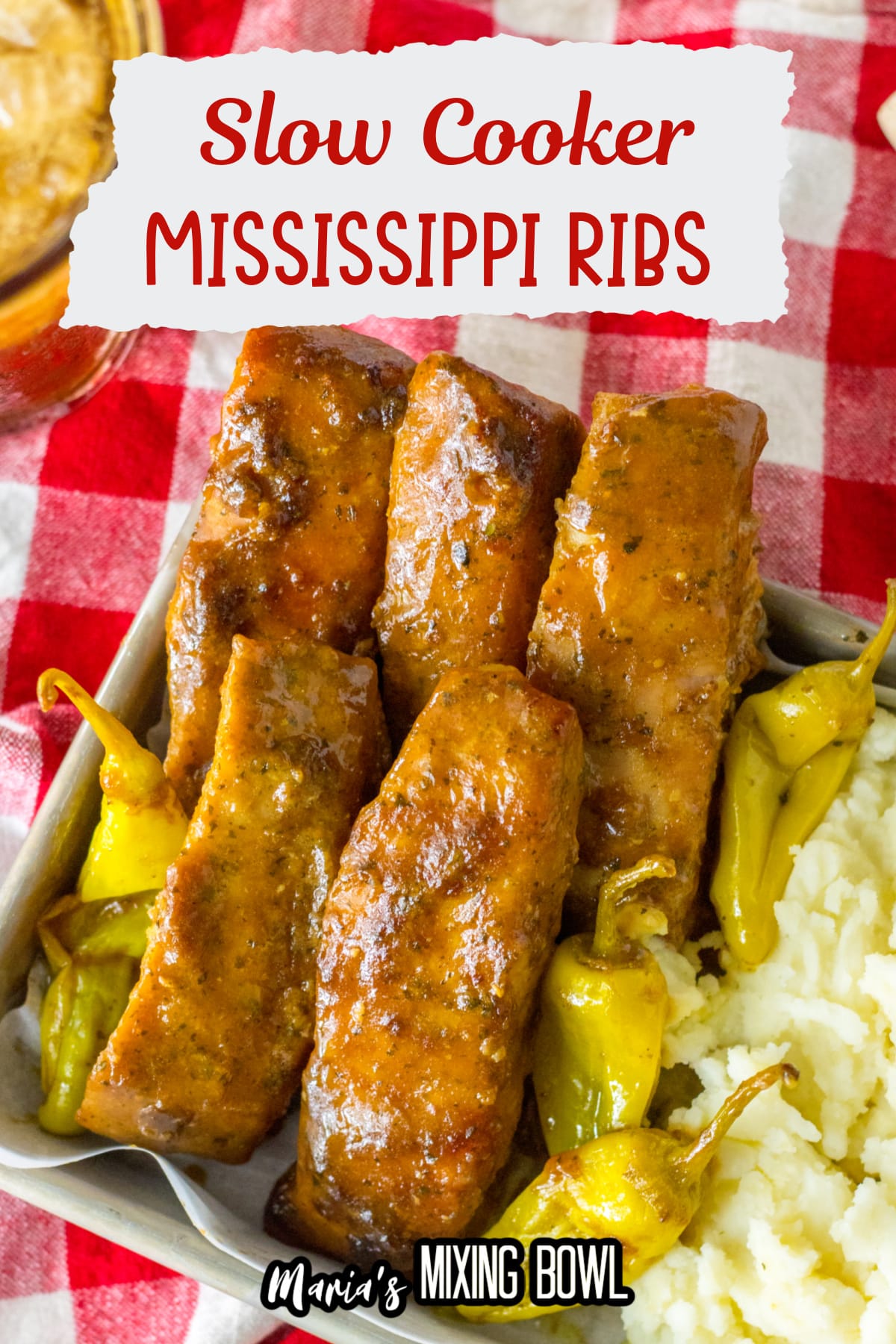 Mississippi ribs in a metal baking tray with mashed potatoes
