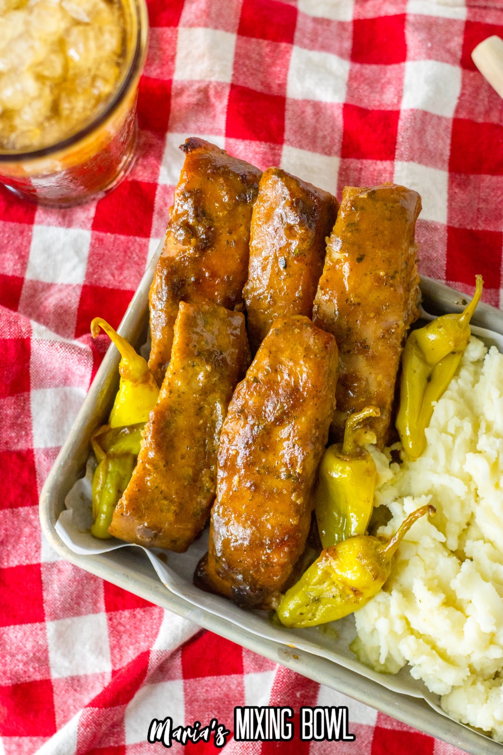 Mississippi ribs in a metal baking tray with mashed potatoes