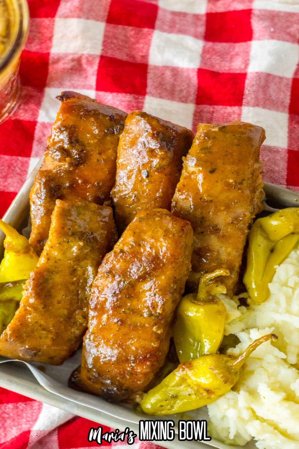 Mississippi ribs in a metal baking tray with mashed potatoes