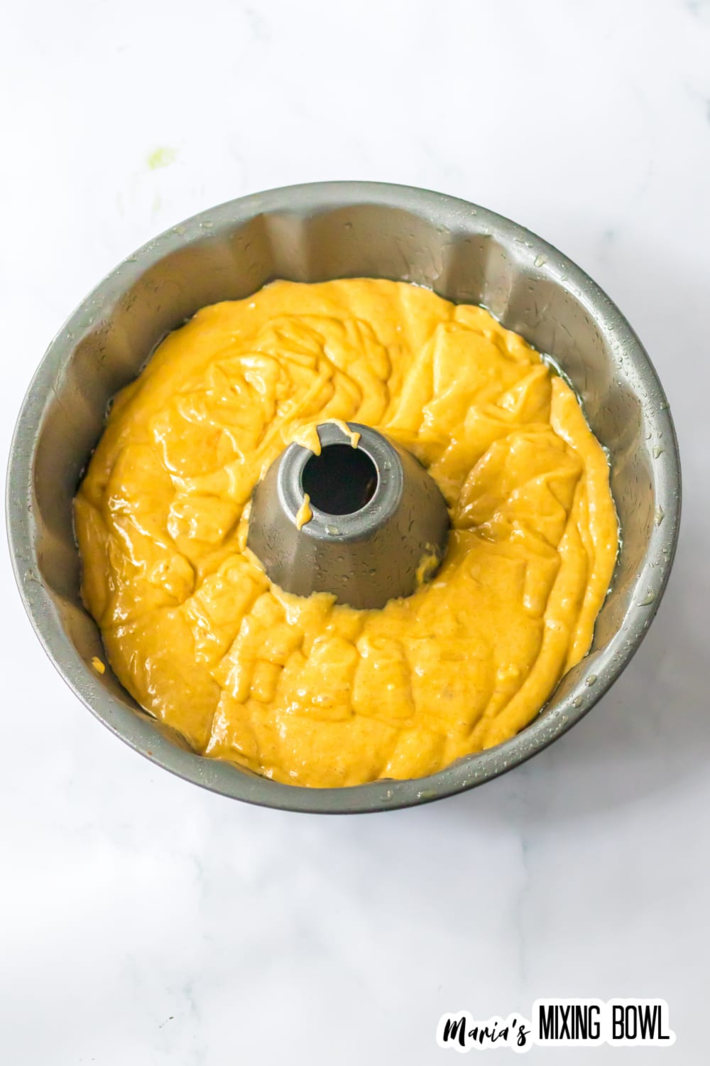 cake batter in a bundt cake pan.