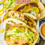 four big mac tacos and a side of fries on a white platter.