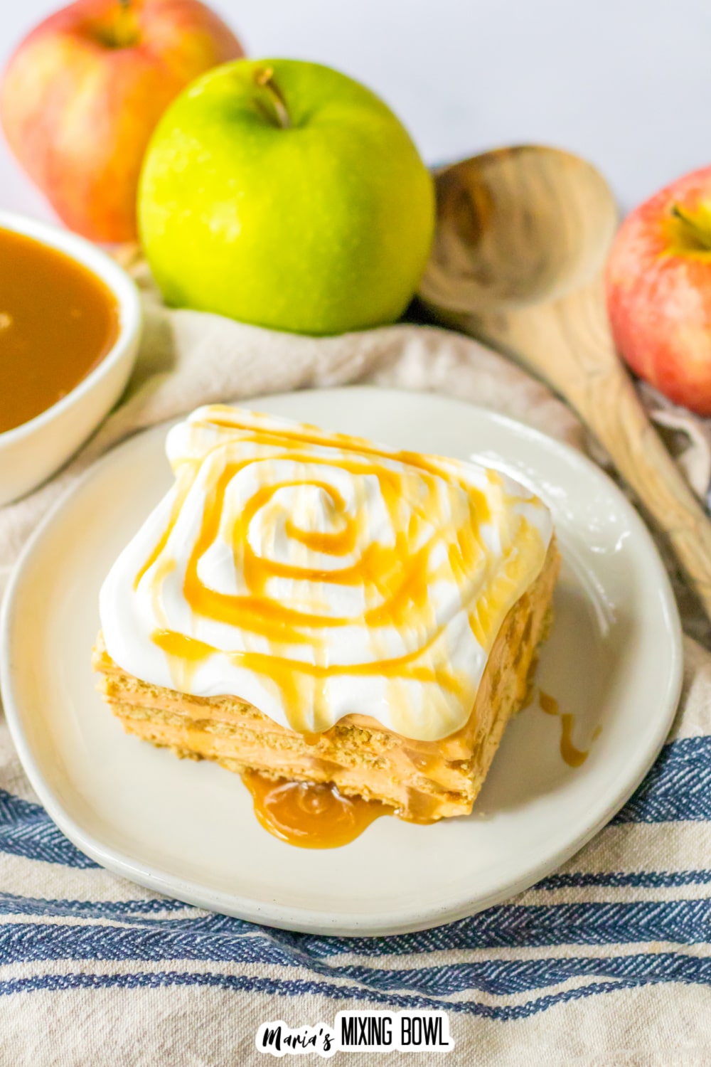 slice of caramel apple icebox cake on a white plate.