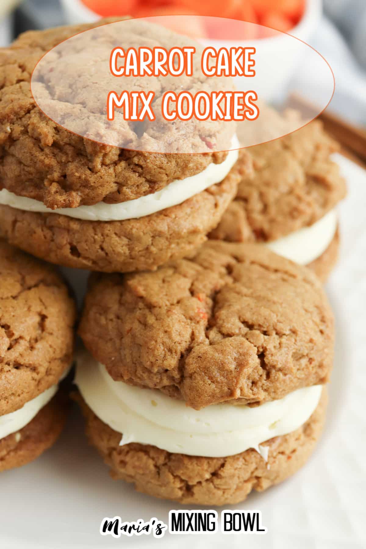 carrot cake mix sandwich cookies stacked on a white plate.