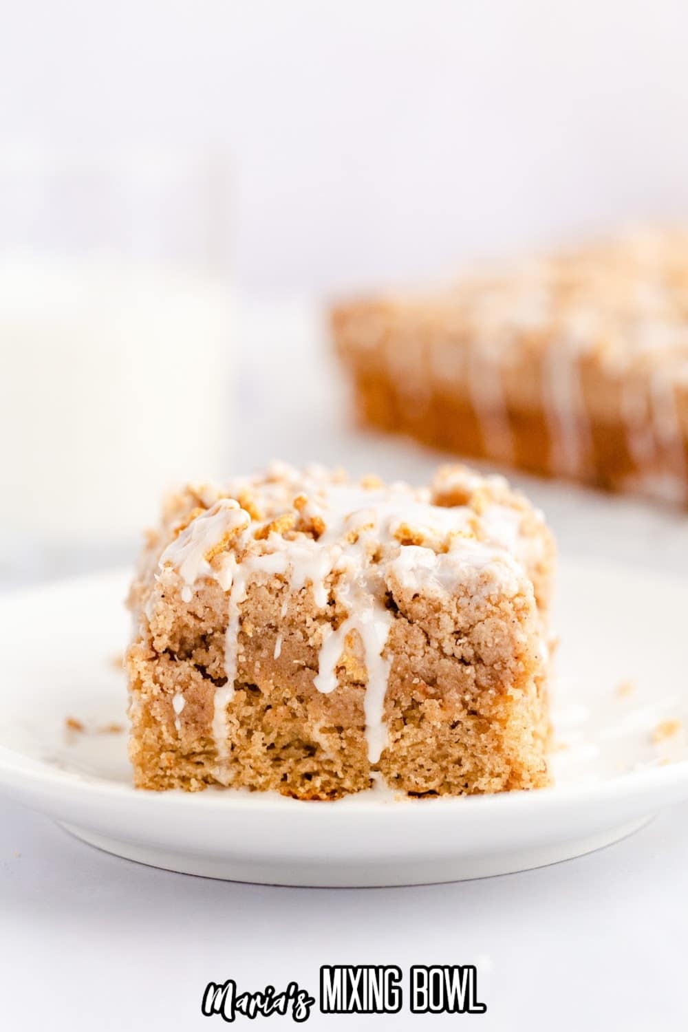 slice of cinnamon toast crunch cake on a small white plate.