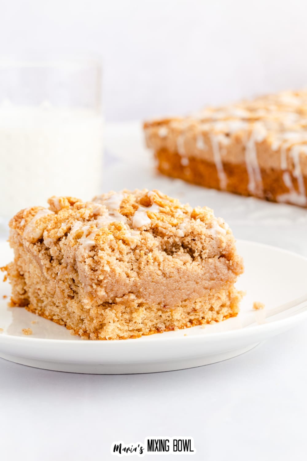 slice of cinnamon toast crunch cake on a small white plate.