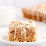 slice of cinnamon toast crunch cake on a small white plate.