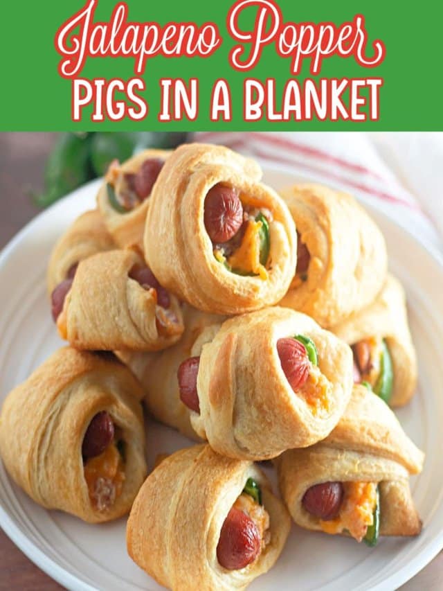 jalapeno crescents pigs in a blanket stacked on top of each other on a plate.