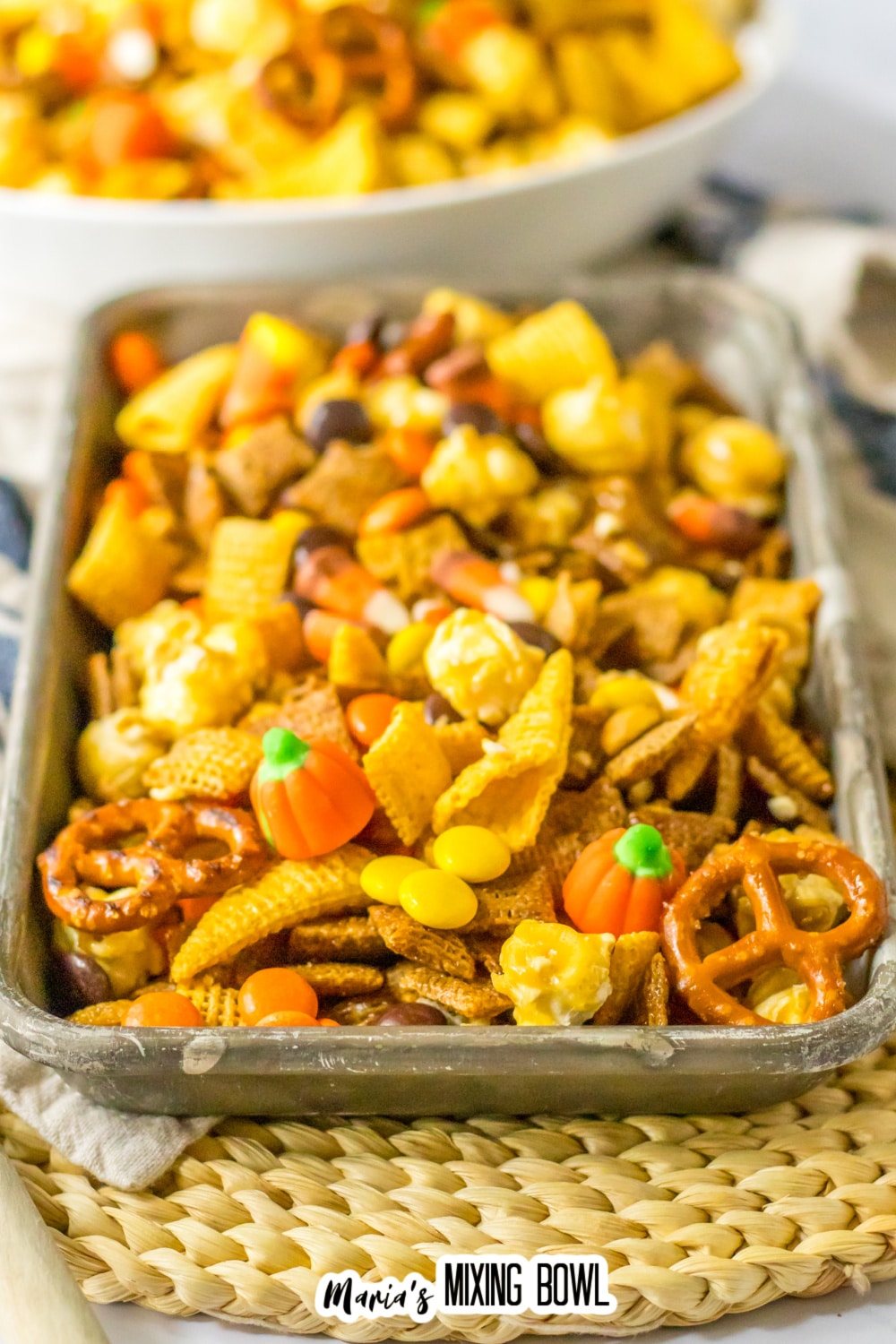 metal serving tray filled with fall chex mix.