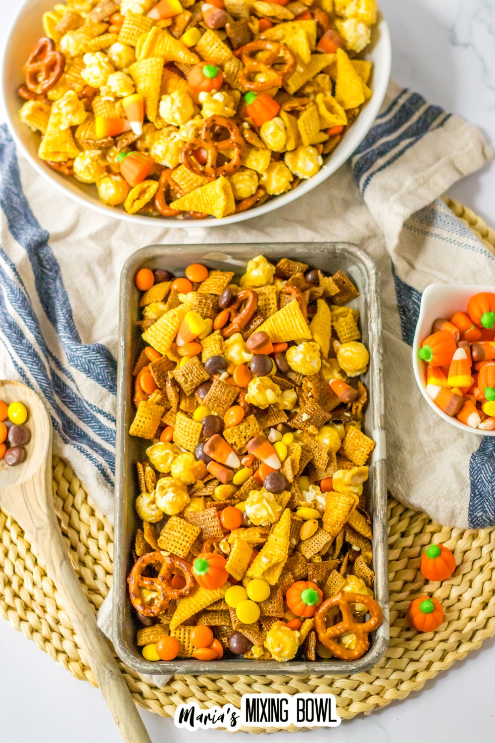 metal serving tray filled with fall chex mix..