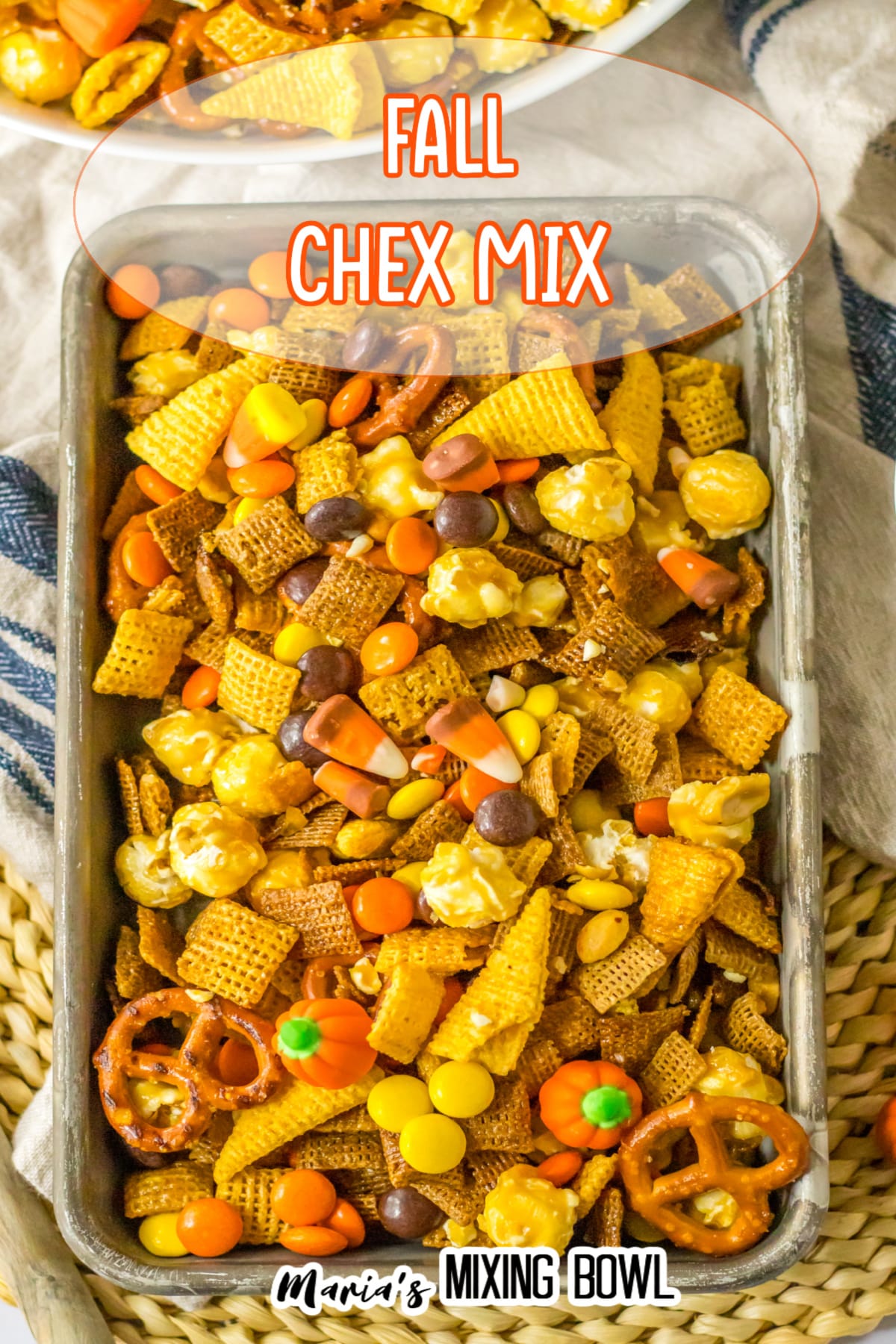 metal serving tray filled with fall chex mix..
