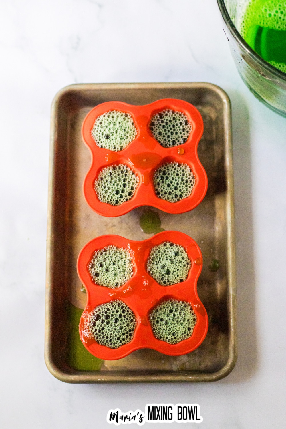 green gelatin poured into ghost molds.