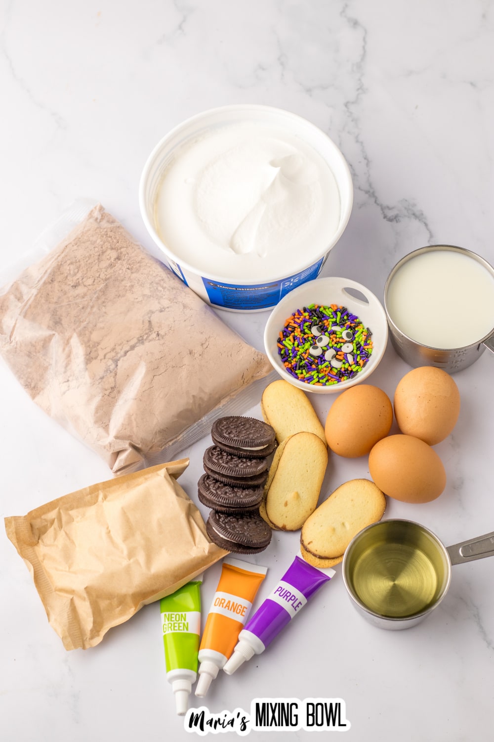 bag of chocolate cake mix, white chocolate pudding, oreo cookies, milano cookies, eggs, oil, milk, cool whip, sprinkles, and food coloring.