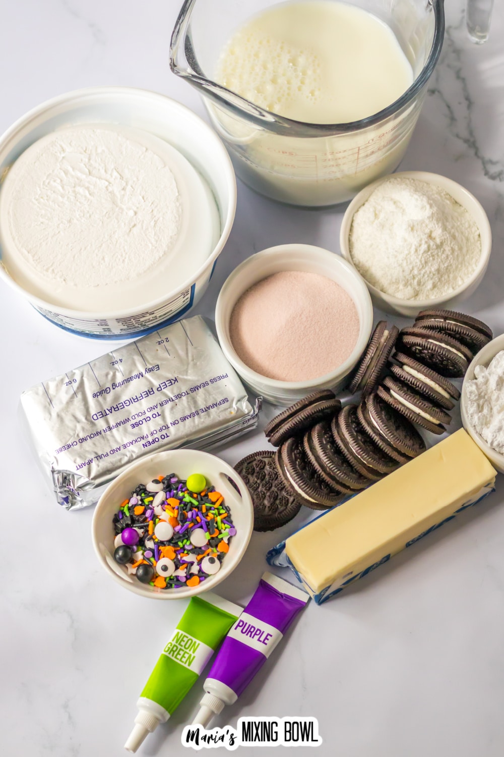 bowls of milk, instant pudding mix, gelatin mix, whipped topping, cream cheese, oreo cookies, butter, powdered sugar, halloween sprinkles, green and purple food coloring gel.