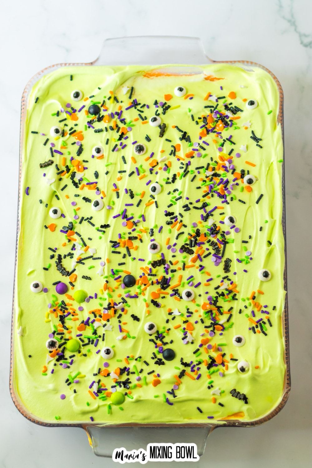 finished halloewen lush topped with sprinkles in a glass baking dish.