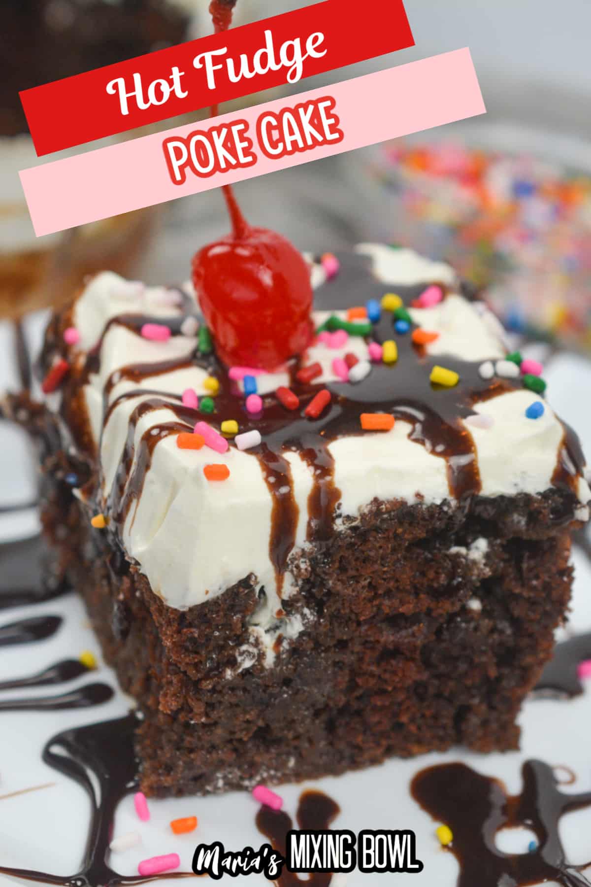 slice of hot fudge poke cake on a plate with a cherry on top.