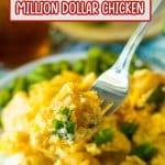 bite of million dollar chicken on a fork held in the air.