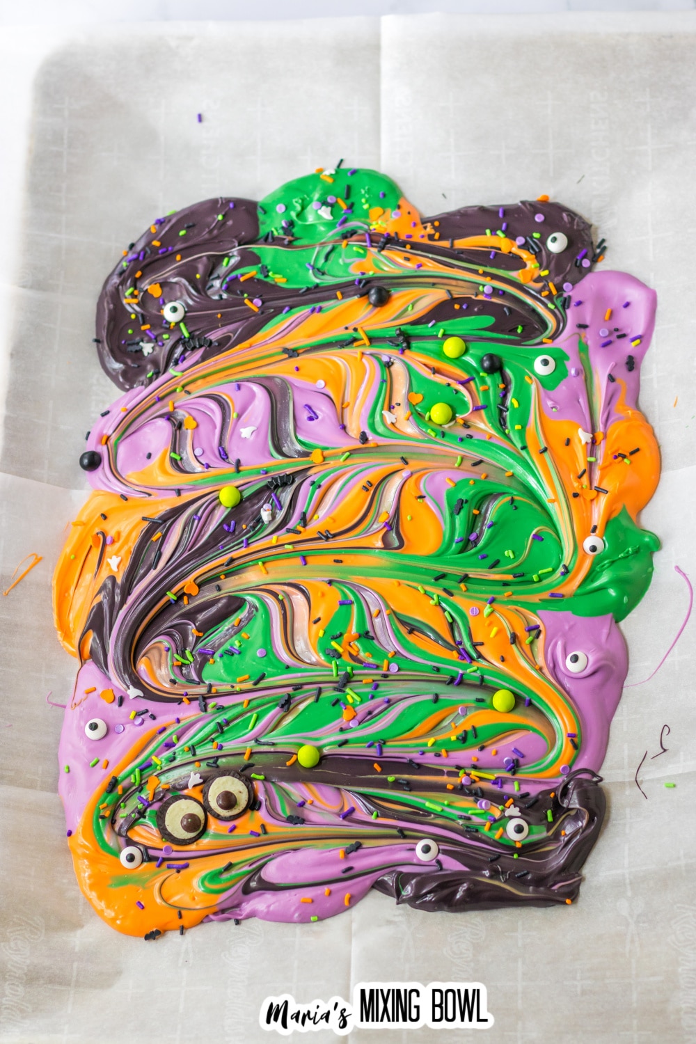 sprinkles being added to the top of melted chocolate.