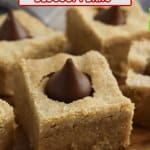 six peanut butter blossom bars on a wooden cutting board.