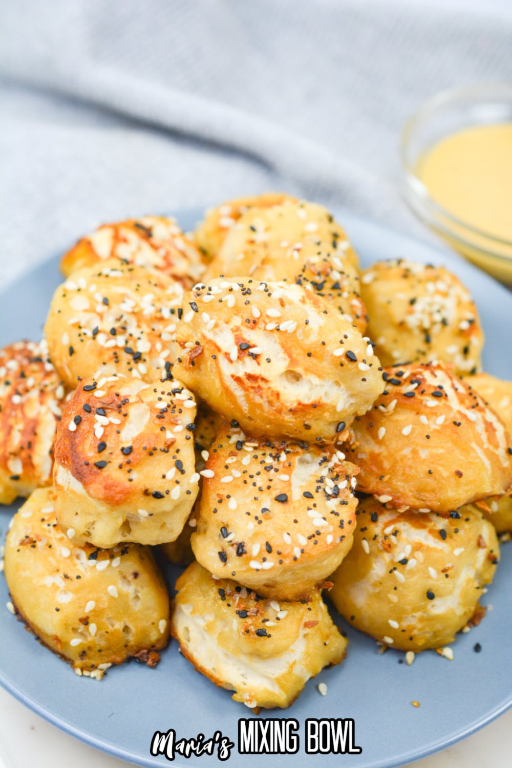 pretzel bites stacked in a pyramid on a plate.