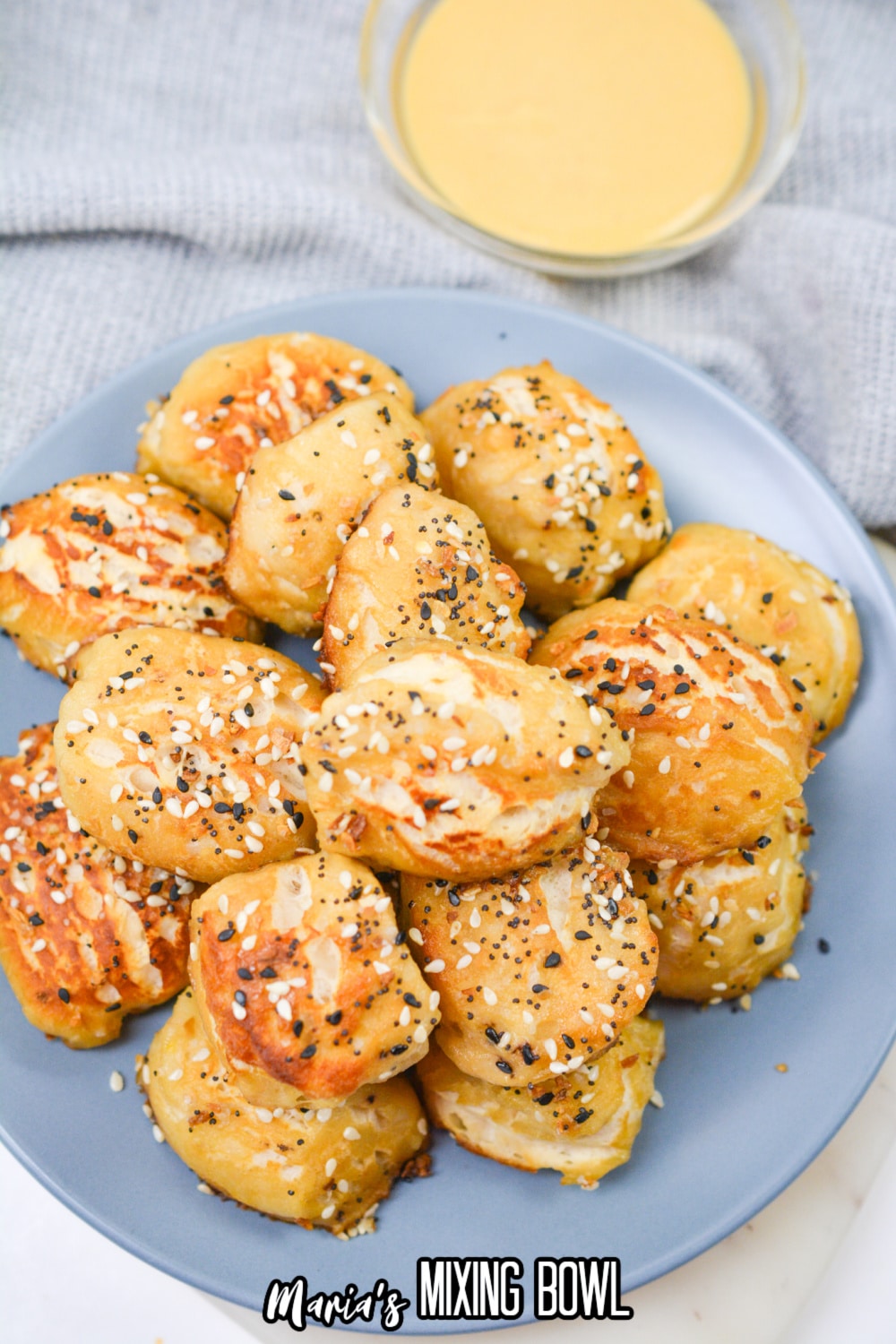 pretzel bites stacked in a pyramid on a plate.