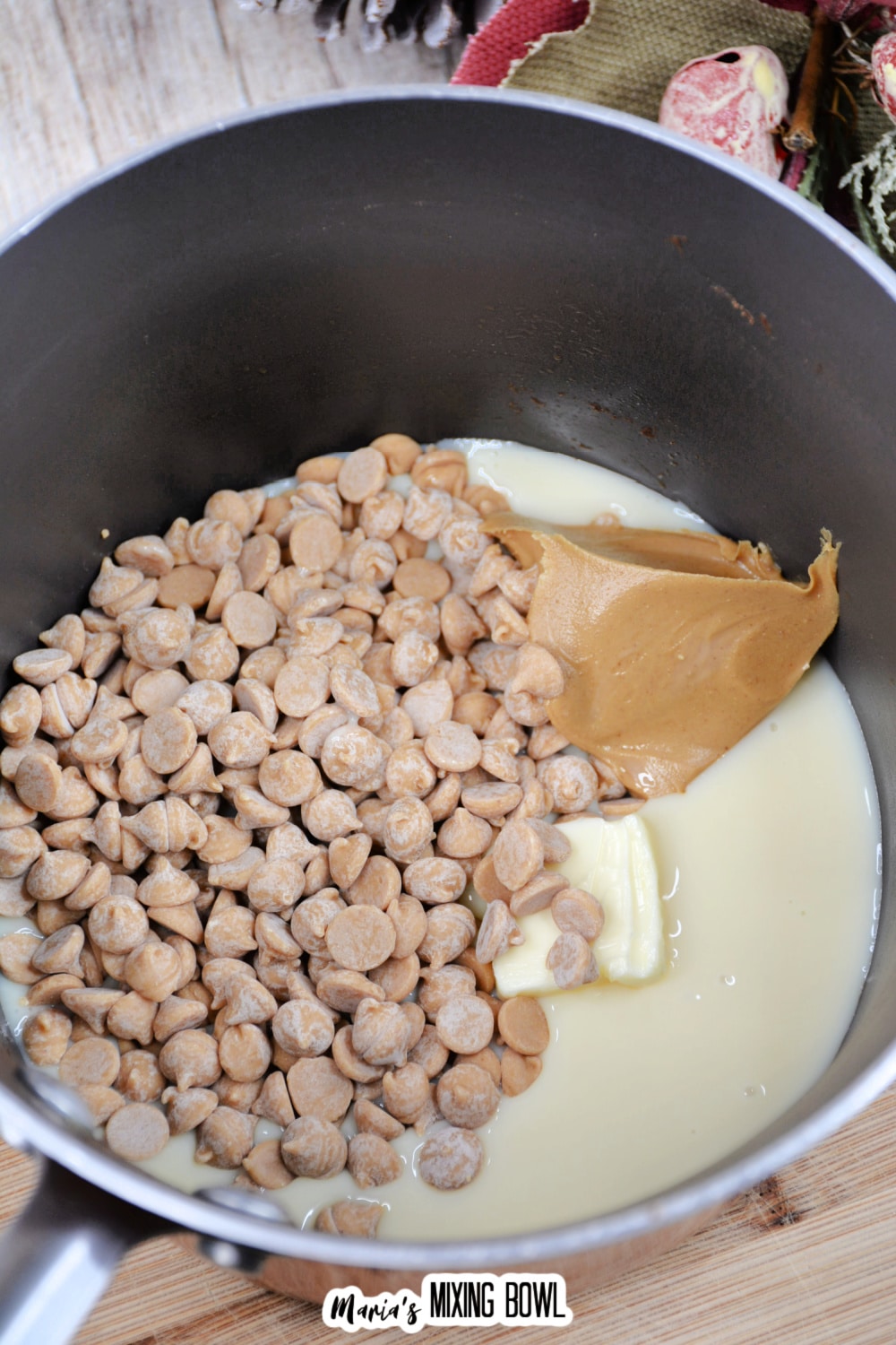 peanut butter chips, peanut butter, butter, and sweetened condensed milk in a saucepan.