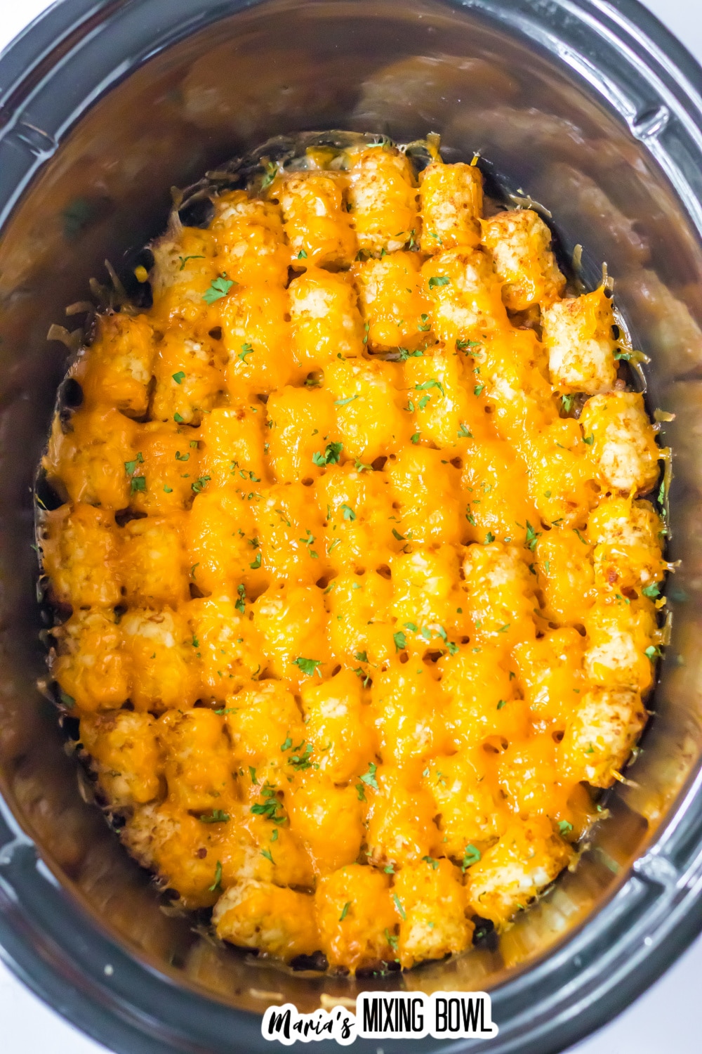 cooked tater tot casserole in the slow cooker.