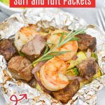 opened foil packet filled with steak, shrimp, and cooked vegetables.