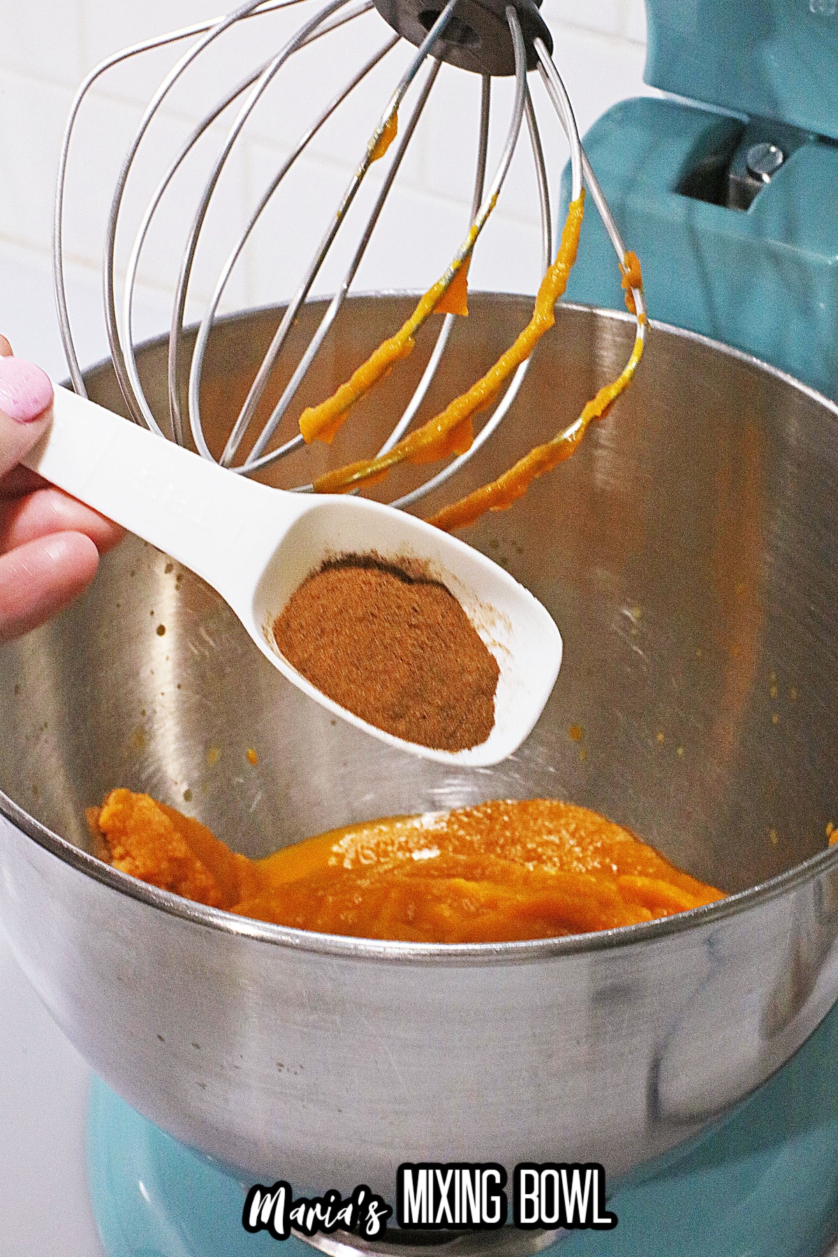 pumpkin pie filling being added to pumpkin filling.