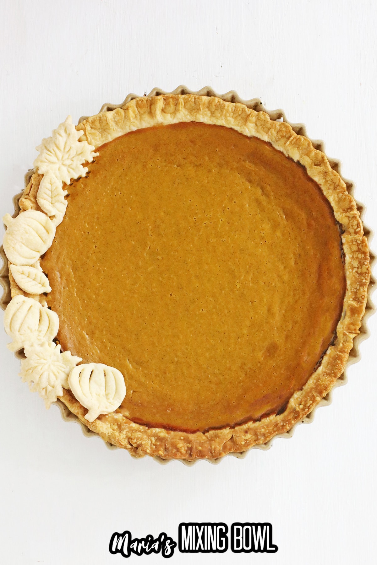 whole uncut baked boozy pumpkin pie.