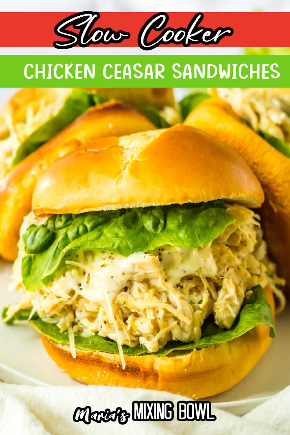 three chicken ceasar sandwiches on a white plate.