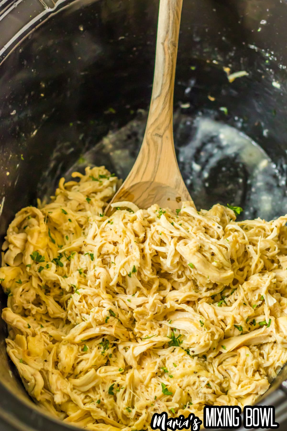 cooked chicken ceasar chicken in a slow cooker.