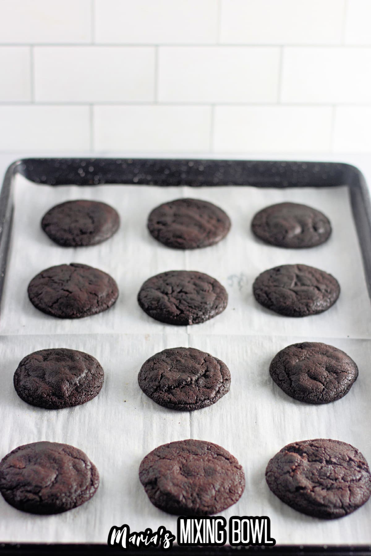 baked cookies cooling on a cookie sheet.