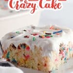 slice of funfetti cake on a white plate with a fork.
