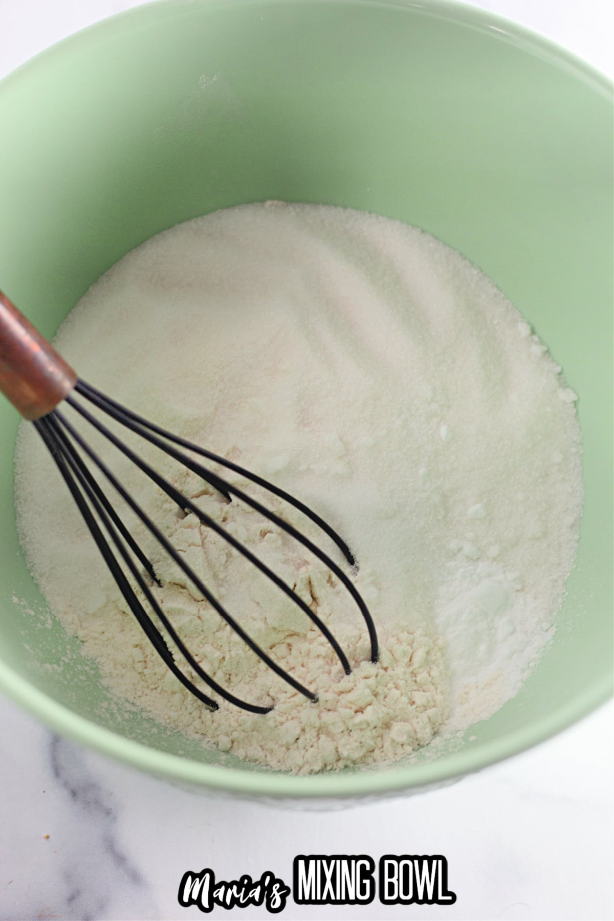 flour, sugar, salt, and baking soda in a mixing bowl.