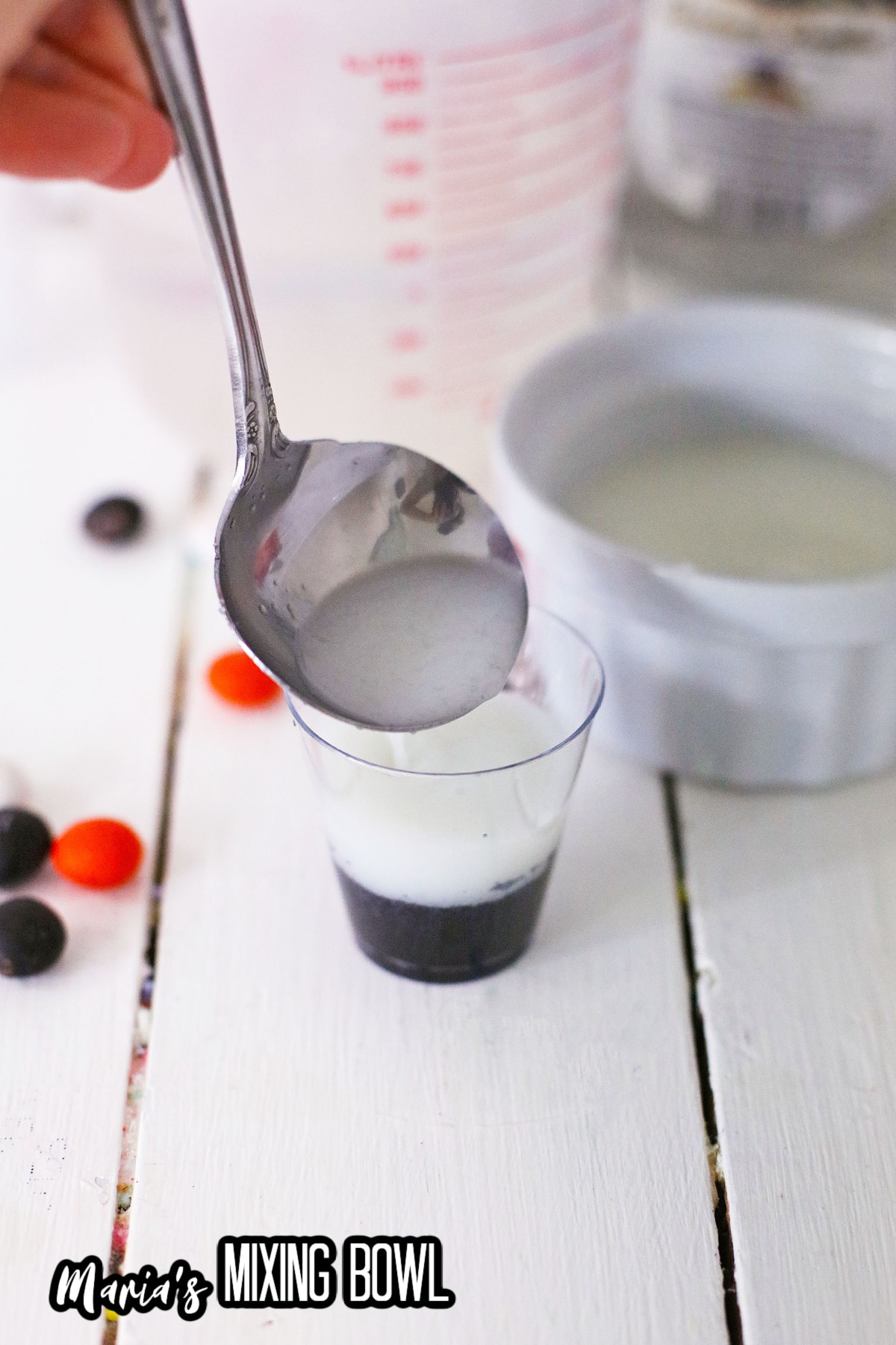white gelatin layer in being poured into the shot glasses.