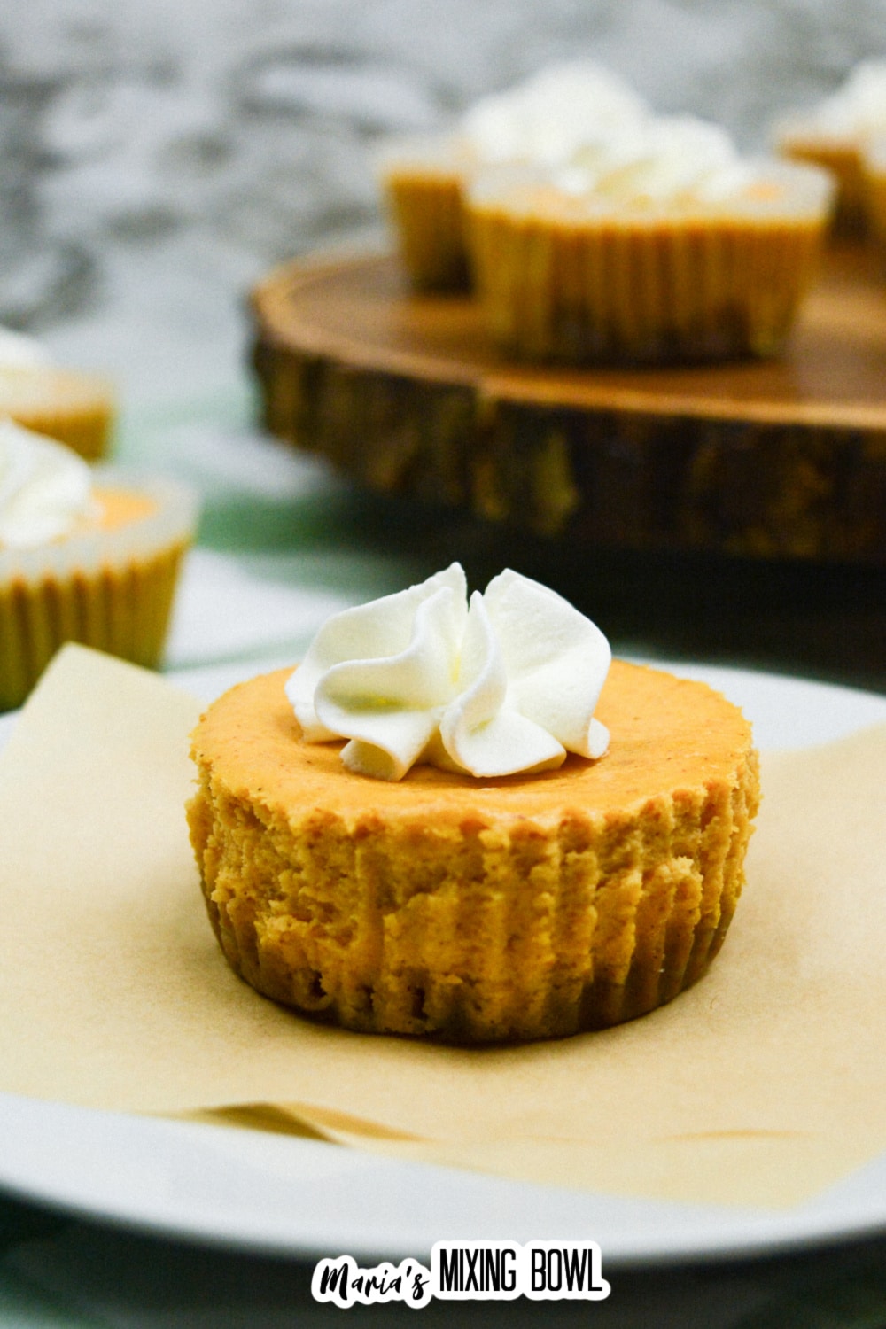 mini pumpkin pie cheesecake on a plate.