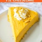 slice of pumpkin cheesecake topped with whipped cream on a plate.