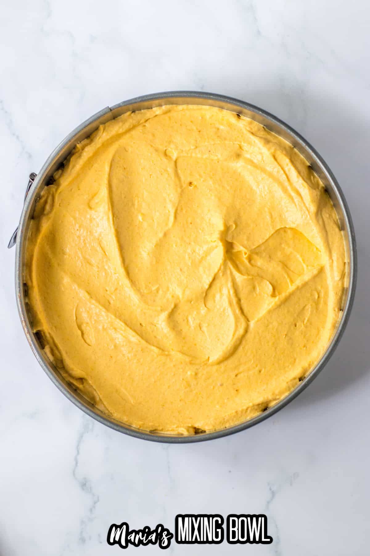 finished cheesecake in a springform pan.