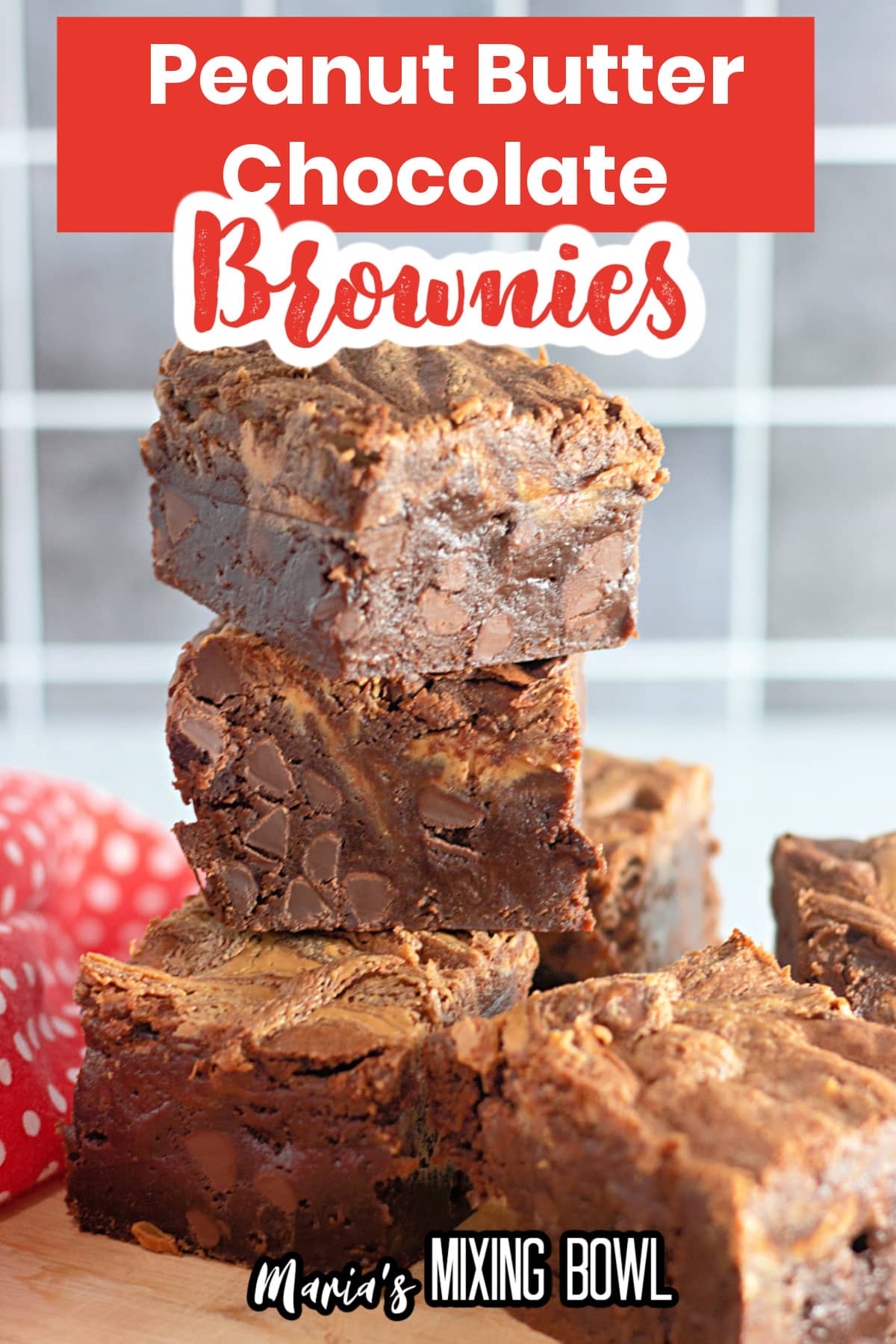 peanut butter chocolate chip brownies stacked on a counter.