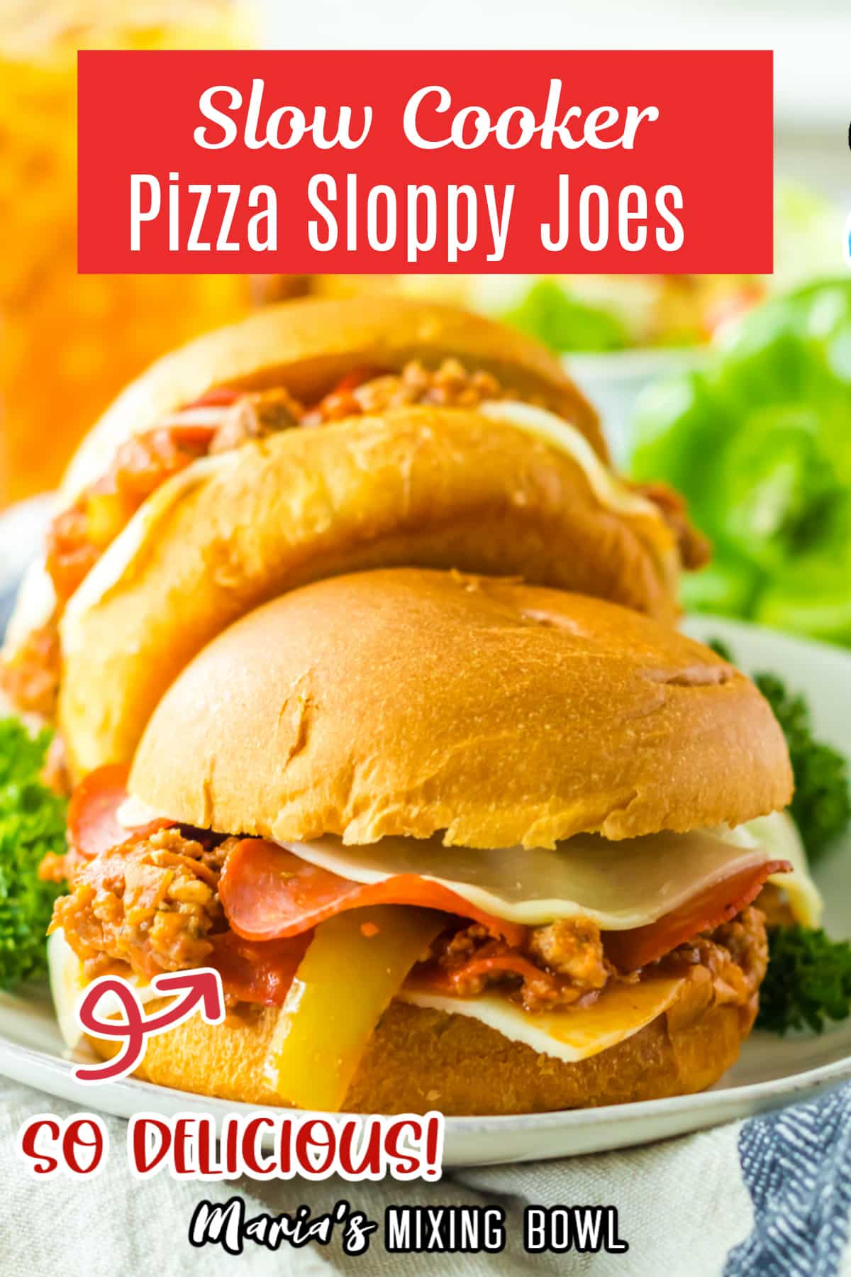 two slow cooker pizza sloppy joes on a white plate.