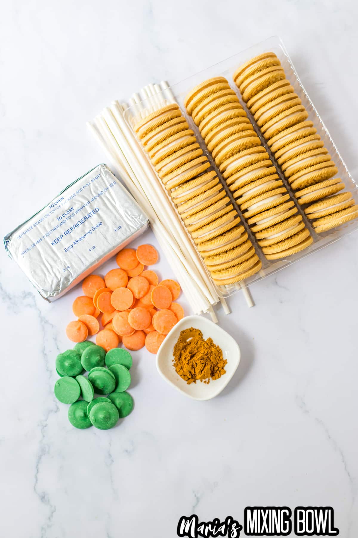 golden oreo cookies, cream cheese, candy melts, and pumpkin pie spice.