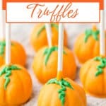 pumpkin oreo truffles on a kitchen towels.