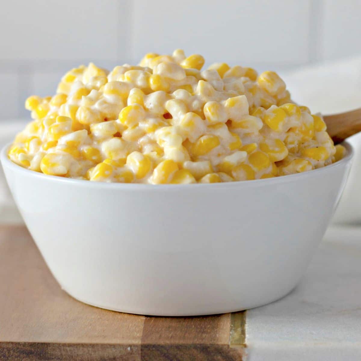 bowl filled with slow cooker creamy corn.