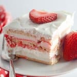 slice of strawberry ice cream cake on a plate.