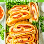 slices of stuffed pepperoni bread on a metal serving tray.