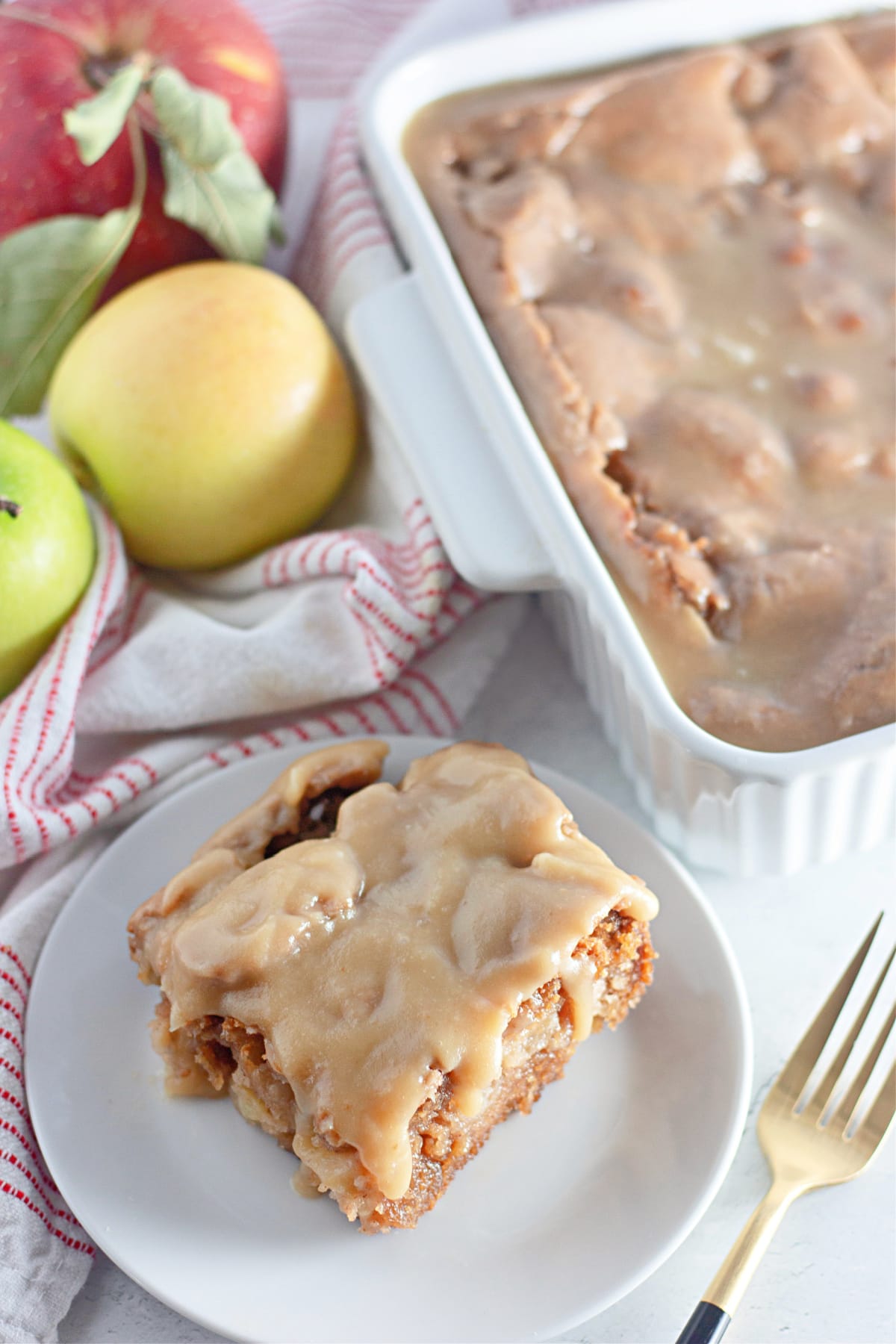 slice of apple dapple cake on a plate.