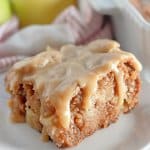 slice of apple dapple cake on a plate.