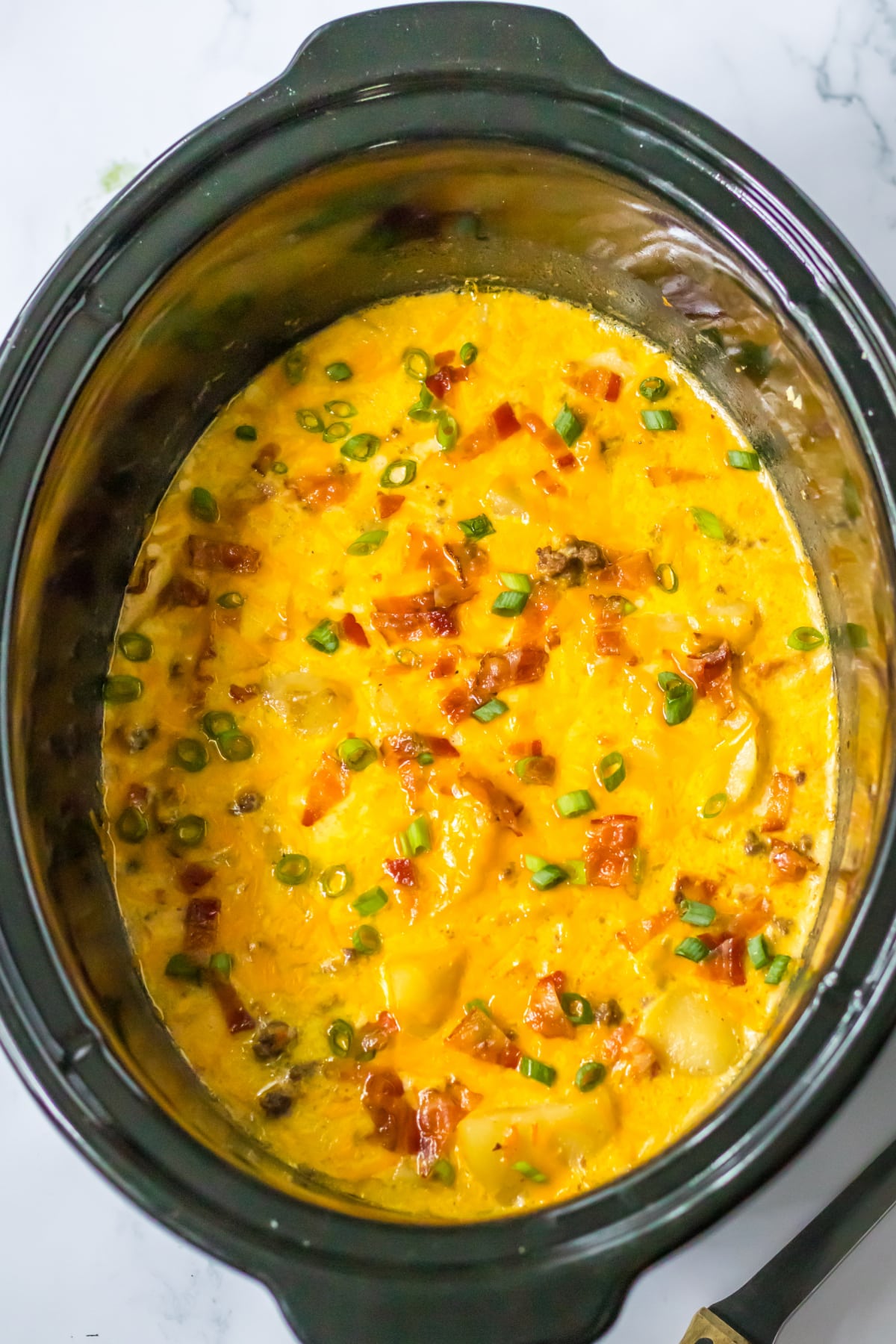 cooked bacon cheeseburger soup in a slow cooker.